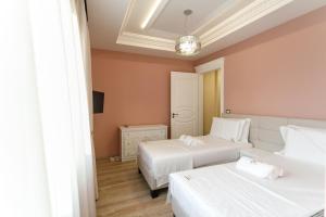 Postel nebo postele na pokoji v ubytování Elite Palace