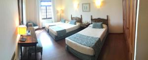Postel nebo postele na pokoji v ubytování Hotel Pazo O Rial