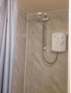 a shower in a bathroom with a shower at Alexandra Annexe in Bath