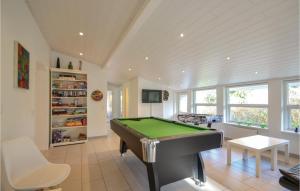 a living room with a pool table in it at Beautiful Home In Ebeltoft With Kitchen in Øksenmølle