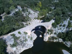 an aerial view of a bridge over a river at La casa de l'Avi in Tortellá +83 photos