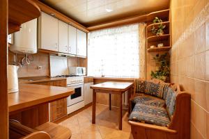 a kitchen with a table and a chair in a room at Однокомнатные апартаменты в районе ТРЦ Фабрика in Kherson
