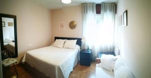 Postel nebo postele na pokoji v ubytování Apartamento Rías Baixas - 1a Línea Playa Raxó
