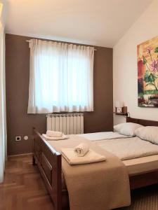 Postel nebo postele na pokoji v ubytování Apartment Karla