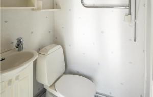 a bathroom with a toilet and a sink at Lovely Home In Trosa With Wifi in Trosa