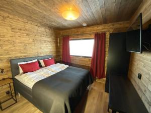 Säng eller sängar i ett rum på Villas Karhunpesä