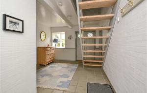 a hallway with a staircase in a house at Holiday Home Fanø 13 in Sønderho