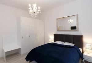 Posteľ alebo postele v izbe v ubytovaní KDRO Apartment Rynek