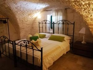 A bed or beds in a room at Maison MilleOttocento