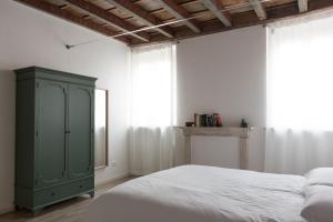 Postel nebo postele na pokoji v ubytování Residenza Giulio Romano