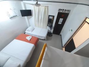 Postel nebo postele na pokoji v ubytování Hotel Arcoiris Girardot