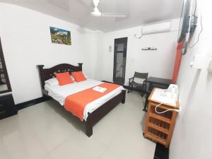 Postel nebo postele na pokoji v ubytování Hotel Arcoiris Girardot