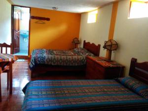 Voodi või voodid majutusasutuse Hostal Curiñan toas