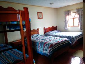 Voodi või voodid majutusasutuse Hostal Curiñan toas