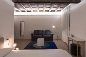 A bed or beds in a room at Residenza Giulio Romano