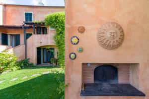 a building with a clock on the side of it at Pin de stèlle in San Martino