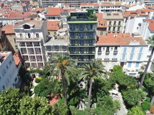 an aerial view of a city with palm trees and buildings at Hôtel de Provence in Cannes