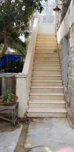 a staircase leading up to a building with a stair case at Berenice Winery Suites in Tiberias