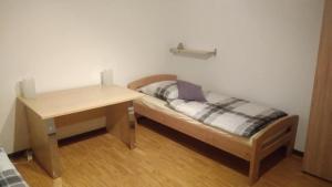 Postelja oz. postelje v sobi nastanitve "Klein und Fein"-Monteurzimmer Pohlheim