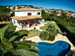 an aerial view of a house with a swimming pool at Villa Miramar, Luxury Villa Rental - Javea in Balcon del Mar