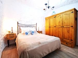 Postel nebo postele na pokoji v ubytování Casa Cueva Azul