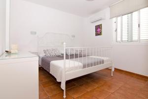 En eller flere senge i et værelse på Casa Piedra Picuda 1