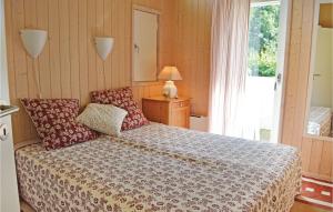 a bedroom with a bed and a window at Amazing Home In Vejby With 3 Bedrooms And Wifi in Vejby