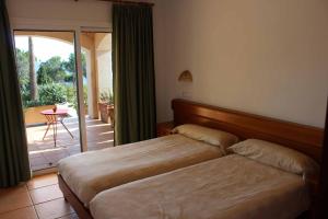 Postel nebo postele na pokoji v ubytování Chalets Torre Nova + 37 fotografií