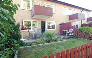 a house with a patio with a table and chairs at Awesome Apartment In Visby With 1 Bedrooms And Wifi in Visby