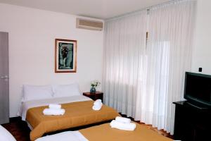 Postel nebo postele na pokoji v ubytování Rosa Garden B&B