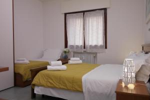 Postel nebo postele na pokoji v ubytování Rosa Garden B&B