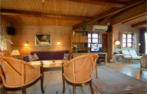 a living room with a couch and chairs at Gimle in Bolilmark