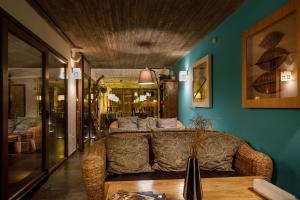 a living room with a couch and a table at Eco Hotel Boutique & Spa Capitulo Trece - Adults Only in Maderuelo