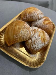 a tray of croissants and pastries on a table at Relais Borbonico in Naples