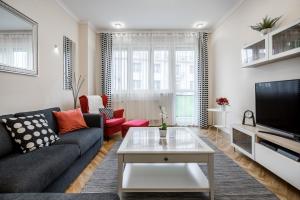 Televízia a/alebo spoločenská miestnosť v ubytovaní BpR Danube Panoramic Suite