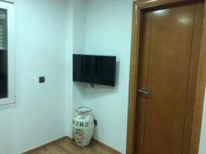 TV a/nebo společenská místnost v ubytování Ílios Soho Apartamentos