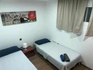 Postel nebo postele na pokoji v ubytování Ílios Soho Apartamentos