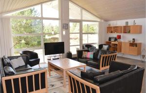 Μια τηλεόραση ή/και κέντρο ψυχαγωγίας στο Holiday Home Jtagholmsvej Rømø Xi Denmk +13 φωτογραφίες