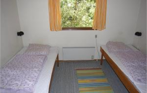 Katil atau katil-katil dalam bilik di Holiday Home Stenbækvej Humble Xi +7 gambar