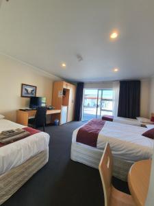 Postel nebo postele na pokoji v ubytování Ocean Inn Motel + 37 fotografií