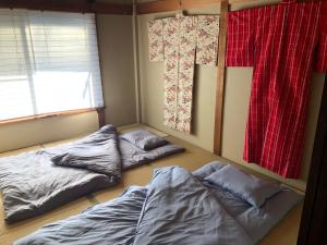 Postelja oz. postelje v sobi nastanitve Masaru House