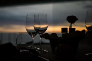 three glasses of wine sit on a table at Head over Hills in Knysna
