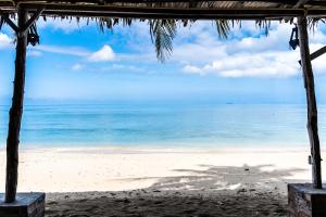 a view of the beach from a beach house at Isara Lanta Beach Resort in Ko Lanta
