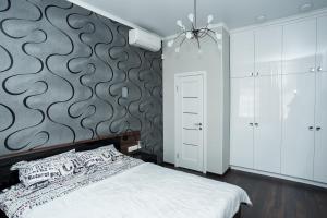 Кровать или кровати в номере Квартира в центре для гурманов стиля
