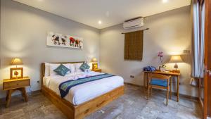 A bed or beds in a room at Prema Ubud Romantic Villas