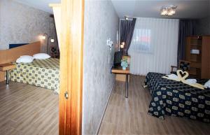 Postel nebo postele na pokoji v ubytování Iris Hotel