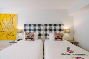 Ein Bett oder Betten in einem Zimmer der Unterkunft Burasari Phuket Resort & Spa