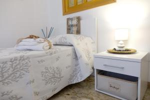Postel nebo postele na pokoji v ubytování Don Alfonso Apartaments