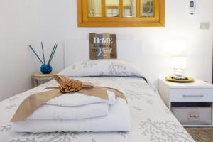Postel nebo postele na pokoji v ubytování Don Alfonso Apartaments