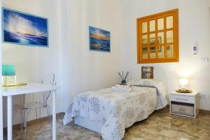 Postel nebo postele na pokoji v ubytování Don Alfonso Apartaments
